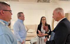 Miskelly Furniture’s Gentry Prestwood, left, Oscar Miskelly and Anna Lucovich listen to Klaussner rep Dick Gautreaux during their visit to the Klaussner showroom on Friday morning.