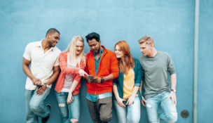 Gen Z, group of young people looking at smartphones stock image